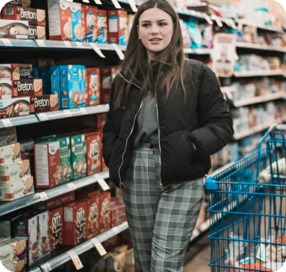 woman walking down grocery aisle